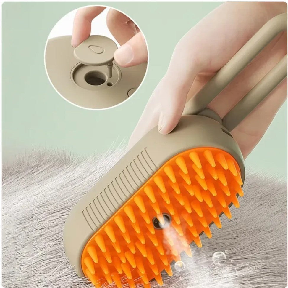 Furlouve 3-in-1 steam pet brush with orange silicone bristles and a beige handle, releasing steam for cleaning.