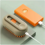 Furlouve 3-in-1 steam pet brush in beige and orange, with soft bristles and rechargeable battery.