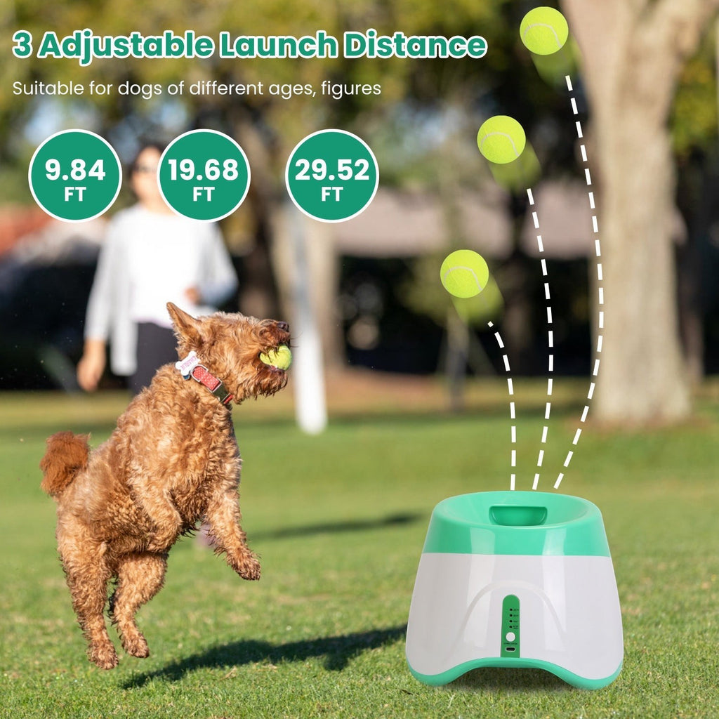 Furlouve automatic dog ball launcher in white and green, launching tennis balls for a dog playing fetch outdoors.