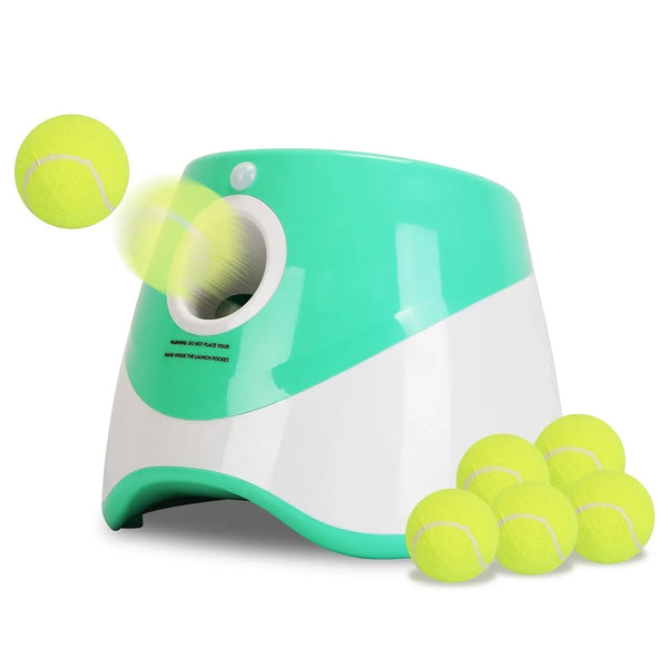 Furlouve automatic dog ball launcher in white and green, with 6 tennis balls. Features 3 distance settings and safety sensors.