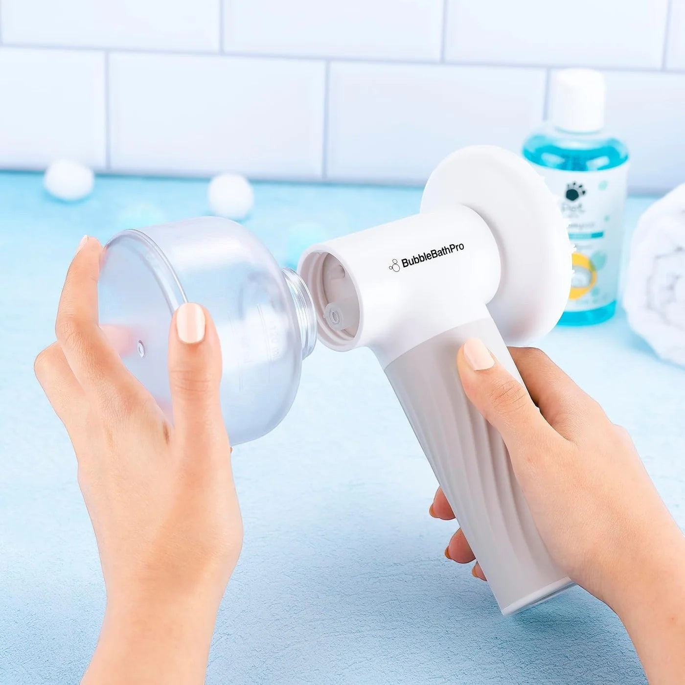 Furlouve automatic foaming pet bath brush with soap dispenser, white and grey silicone and ABS construction.