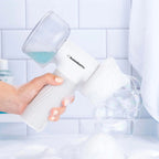 Furlouve white automatic foaming pet bath brush with soap dispenser, creating bubbles for grooming.
