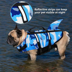 Furlouve AquaGuard dog swim vest in camouflage shark blue with reflective strips and a shark fin detail.