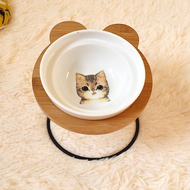 Furlouve Ergonomic Cat Dining Stand with ceramic bowl featuring a tabby cat design, bamboo stand with bear ears.