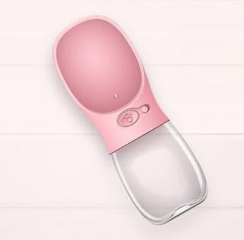 Furlouve pink portable pet water bottle with a built-in trough for easy dispensing and retracting water.
