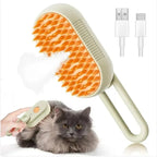 Furlouve 3-in-1 steam pet brush with orange bristles and a light green handle, detangles and cleans pets with gentle steam. Includes USB charging cables.